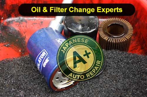 Oil & Filter Change Experts - Image shows used oil filters in a drain bucket - A+ Japanese Auto Repair Inc.
